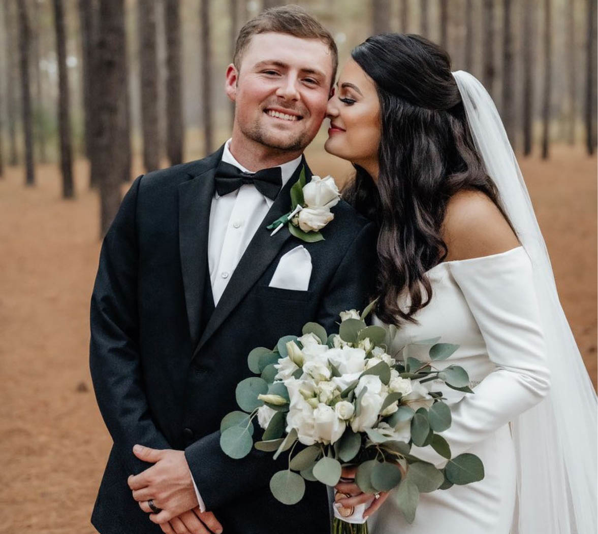 Model wearing a tuxedo suit